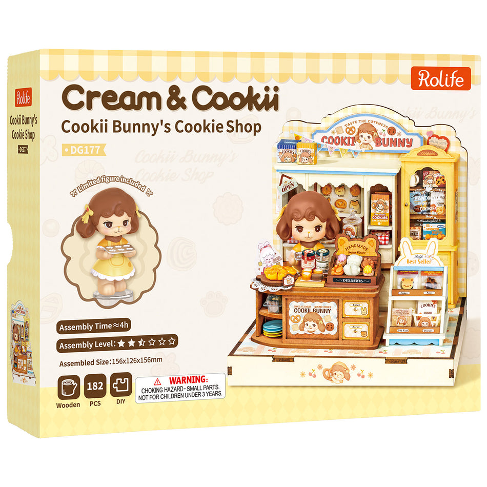 Vorderseite der Verpackung der Robotime Cookii Bunny’s Cookie Shop, Miniaturhaus einer Keksladen mit Cookii Bunny hinter der Theke