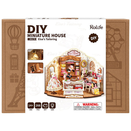 Vorderseite der Verpackung der Robotime Elsa’s Tailoring, DIY Miniaturhaus eines niedlichen Nähateliers