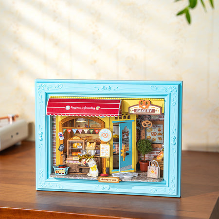 Atmosphärische Präsentation der Robotime Fluffy Cat Bakery, Diorama in einem Rahmen, das eine Bäckerei mit einer Katze zeigt