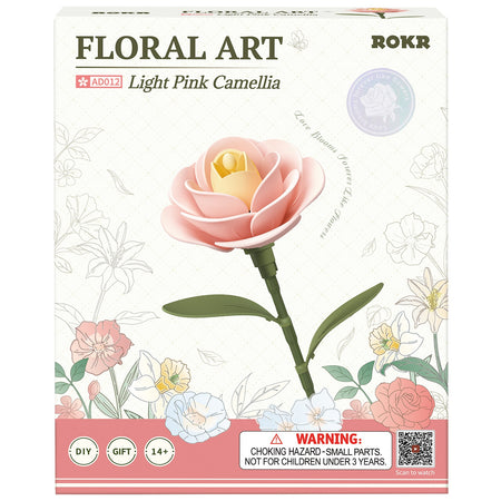 Vorderseite der Verpackung der Robotime Light Pink Camellia, Kunststoffbausatz einer hellrosa Kamelie