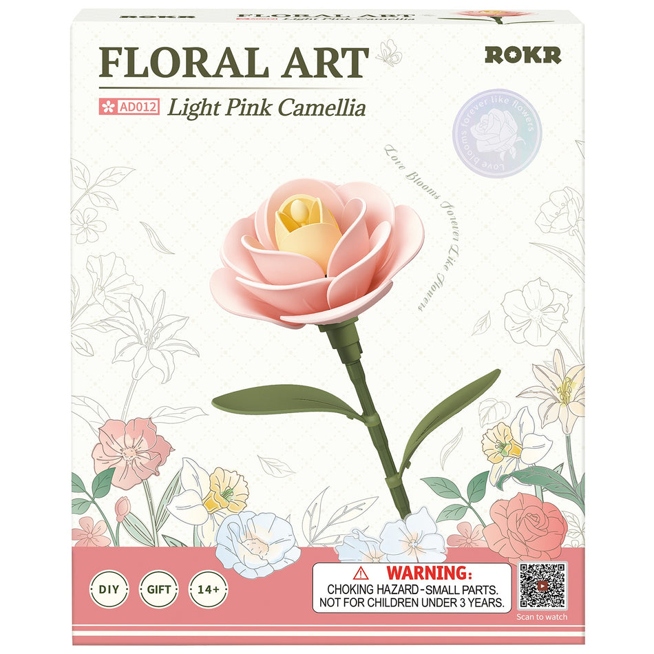 Vorderseite der Verpackung der Robotime Light Pink Camellia, Kunststoffbausatz einer hellrosa Kamelie
