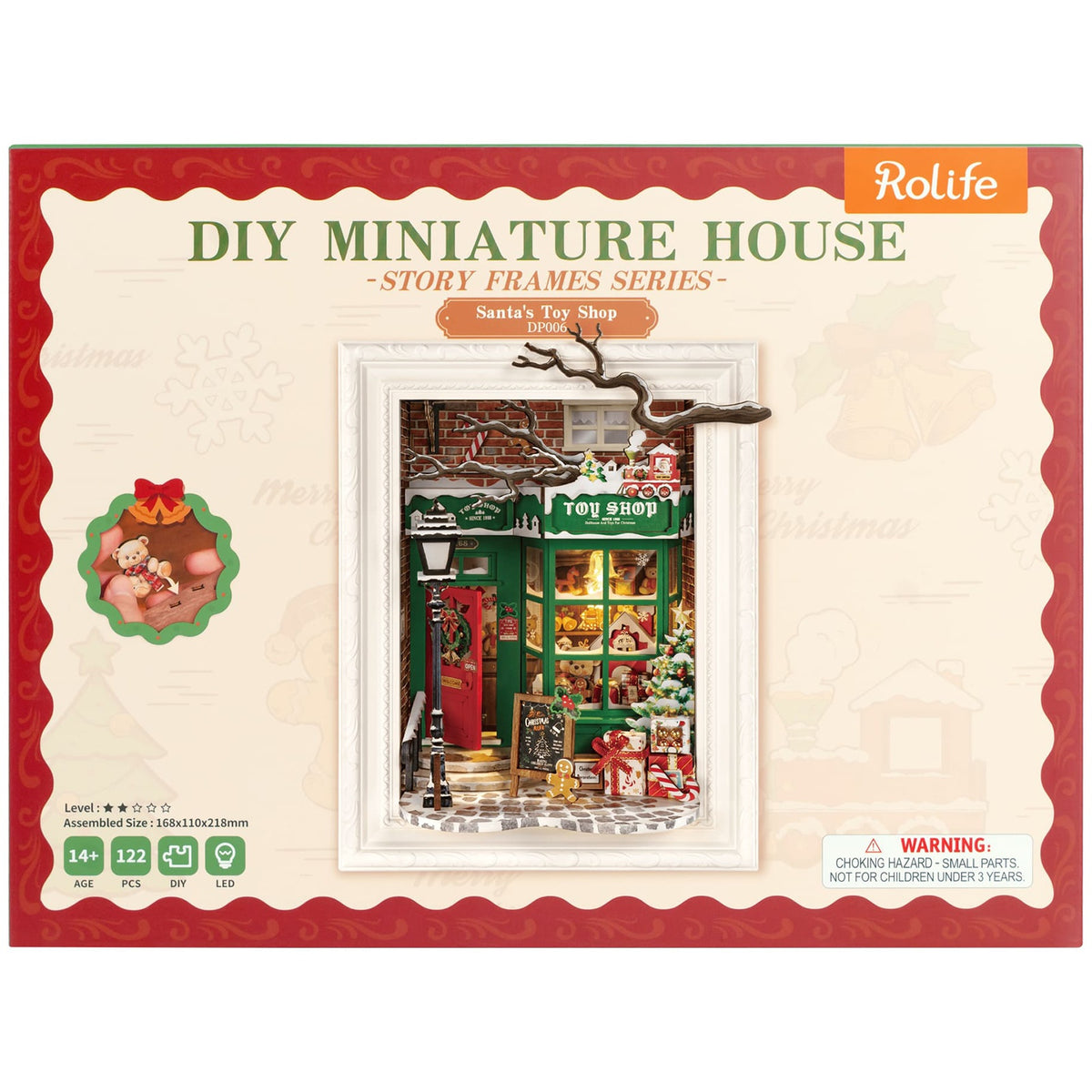 Vorderseite der Verpackung der Robotime Santa’s Toy Shop, Diorama eines weihnachtlich dekorierten Ladens mit Lichtern